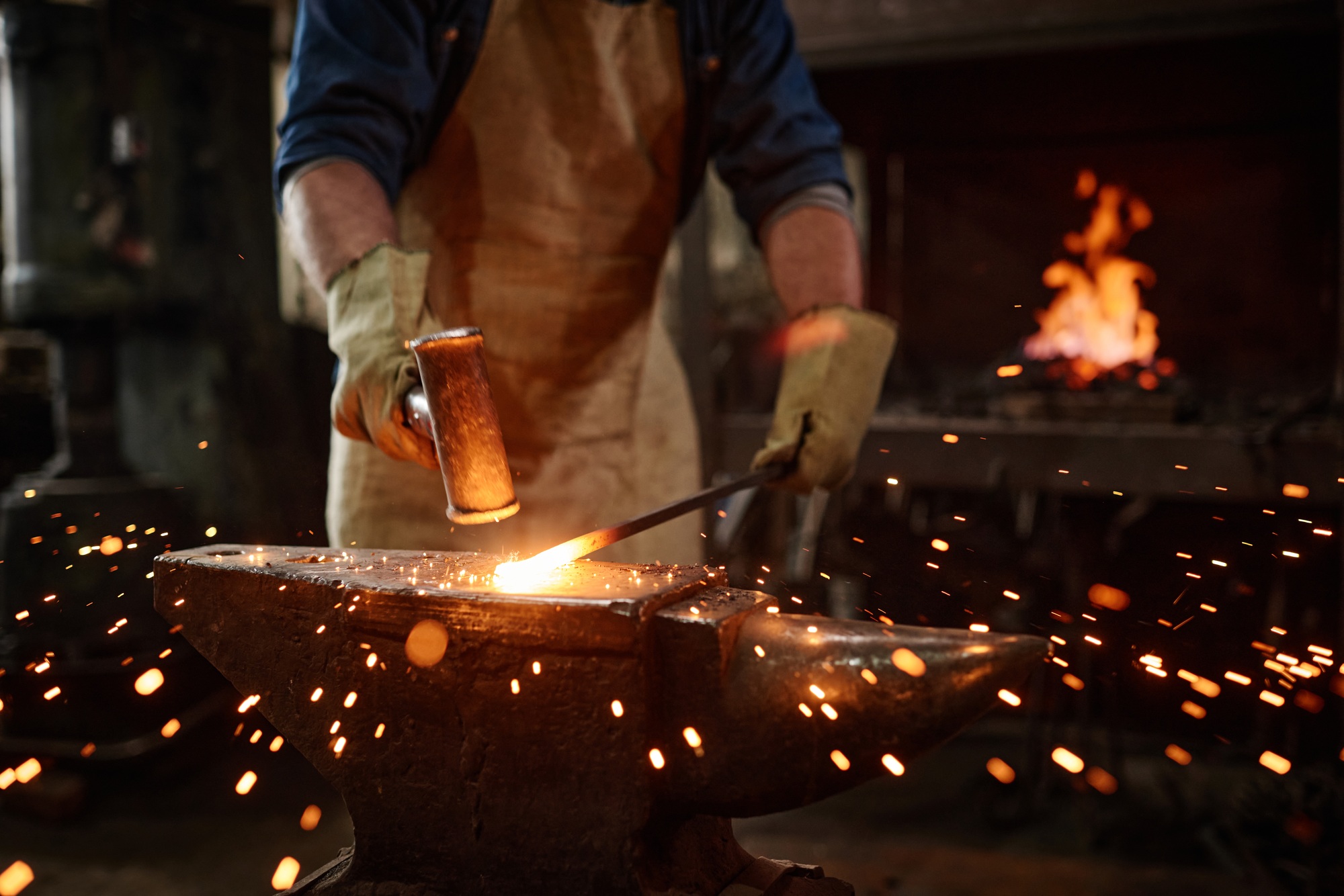 Smith forging the metal
